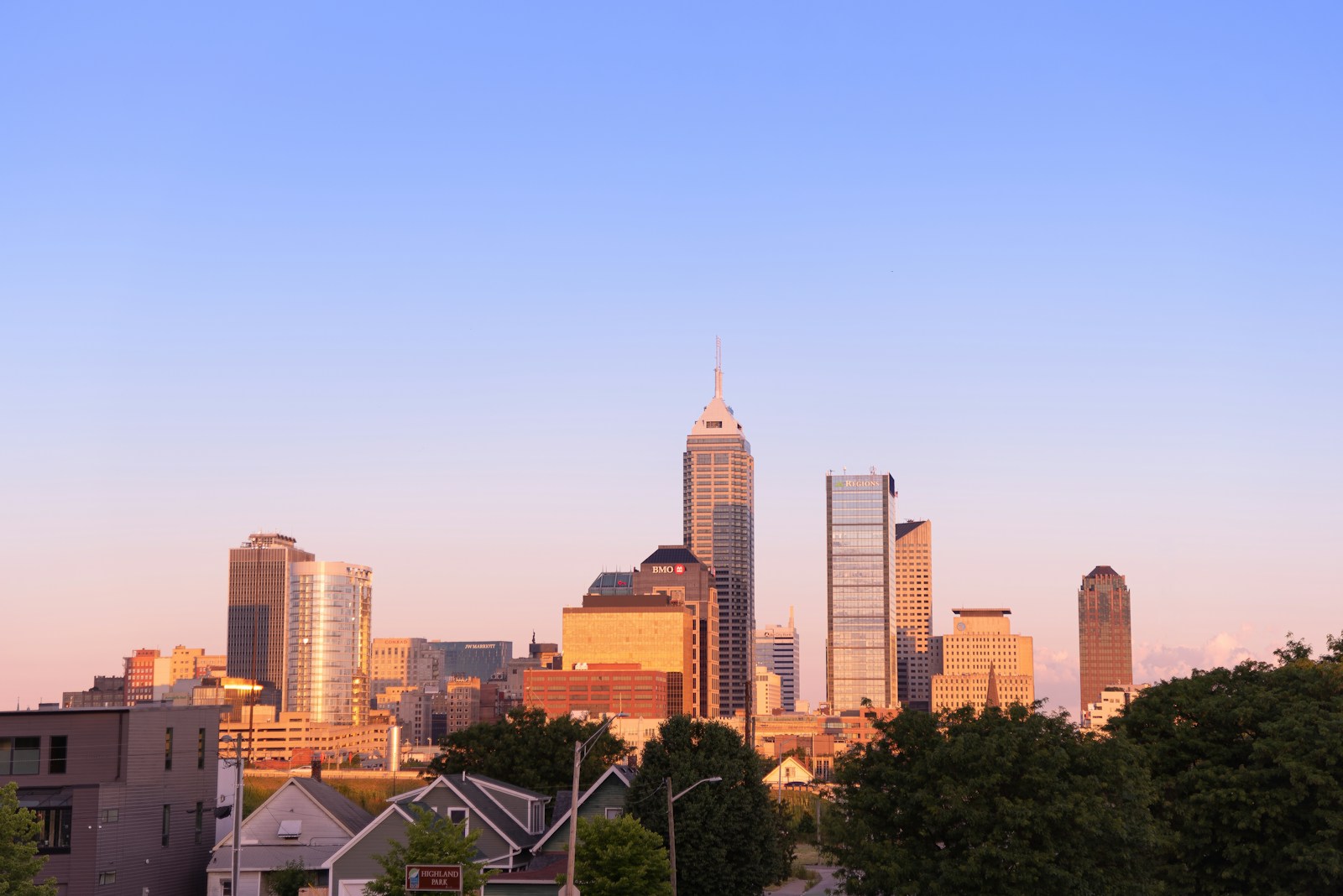 Downtown Indianapolis skyline under blue sky